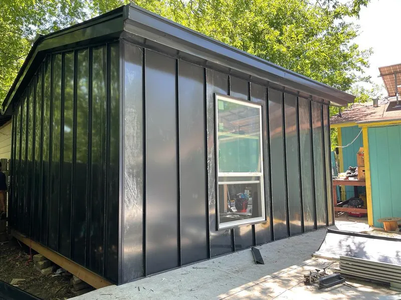 Black standing seam metal wall panels for Roof Inspection in North Kansas City