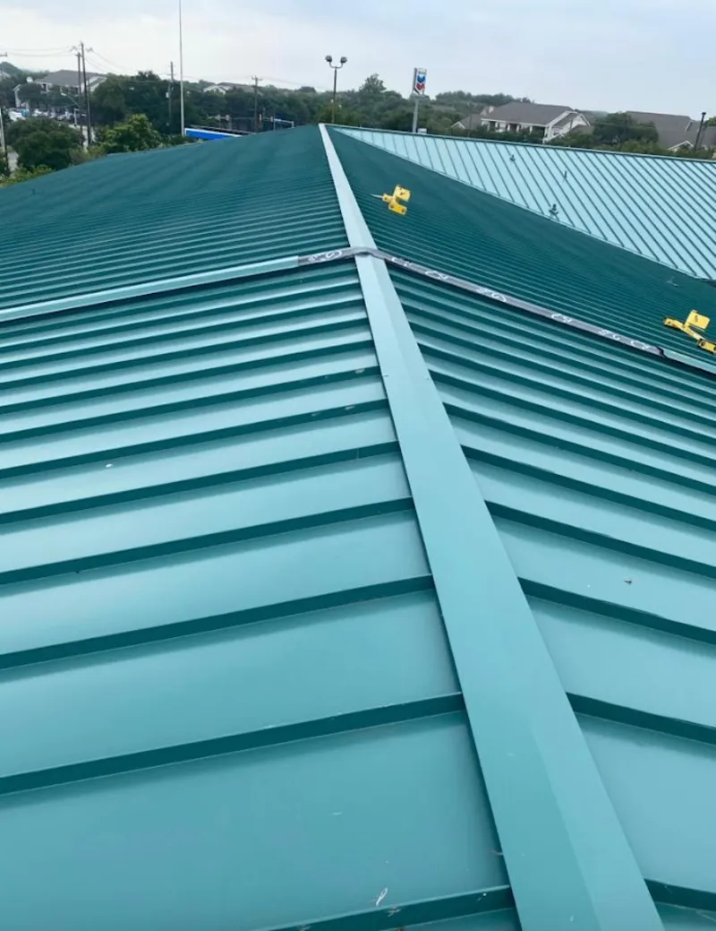Green commercial metal roof ridge and valley for Metal Roof Repair in North Kansas City